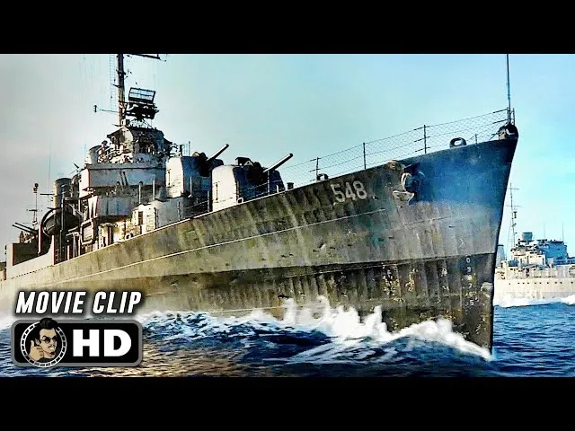World War II naval destroyer ship cutting through choppy ocean waters under clear sky in Greyhound movie clip.